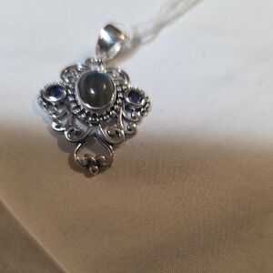 Elegant Sterling Silver Pendant with Blue Accents Larabadorite And Iolite.